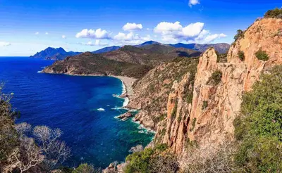 a view of the ocean and a rocky coastline at APPARTEMENT Vue MER TIUCCIA in Casaglione