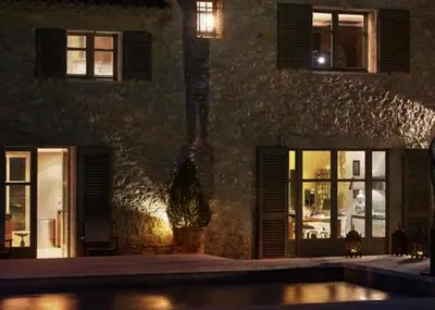 a swimming pool in front of a building at night at Sea and mountain in Prunelli-di-Fiumorbo