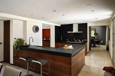 a kitchen with a large island in the middle at Sea and mountain in Prunelli-di-Fiumorbo