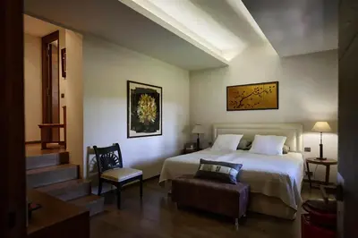 a hotel room with a bed and a chair at Sea and mountain in Prunelli-di-Fiumorbo