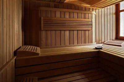 a wooden sauna with a bench and a window at Sea and mountain in Prunelli-di-Fiumorbo