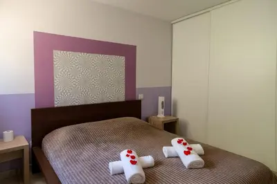 a bedroom with a bed with towels on it at Appartement 225 in Serra-di-Ferro