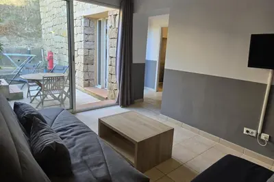 a living room with a couch and a table at Appartement 225 in Serra-di-Ferro