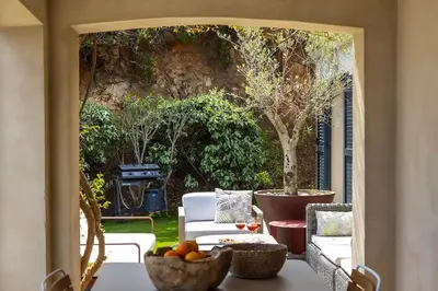 an outdoor patio with a table with fruit on it at Villa 10 personnes avec piscine vue mer in Conca
