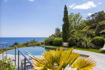 a house with a swimming pool with a view of the ocean at Villa 10 personnes avec piscine vue mer in Conca