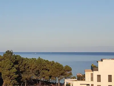 a view of the ocean from a building at Appartement T3 Porticcio résidence les Jardins de Livia in Albitreccia