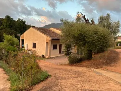 a house on the side of a dirt road at villa paisible de campagne avec piscine in Alata