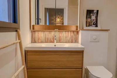 a bathroom with a sink and a mirror at Villa Marina Di Porto-Vecchio in Porto-Vecchio