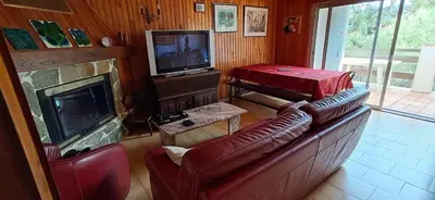 a living room with a couch and a fireplace at Casa di l Ulivu in Porto Pollo