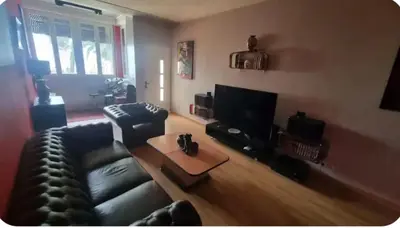 a living room with a couch and a coffee table at F2 idéalement placé route des sanguinaires in Ajaccio