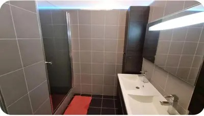 a bathroom with a shower and a sink at F2 idéalement placé route des sanguinaires in Ajaccio