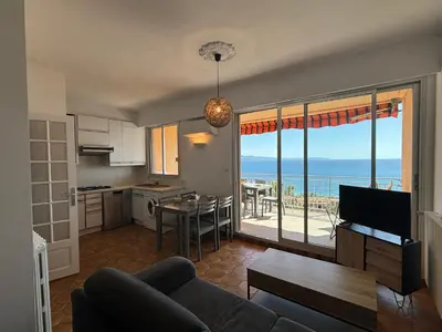 a living room with a view of the ocean at Studio K4 santa lina sanguinaires Ajaccio in Ajaccio