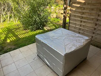 a large mattress sitting on a patio at Mini Villa Alba Rossa in Serra-di-Ferro