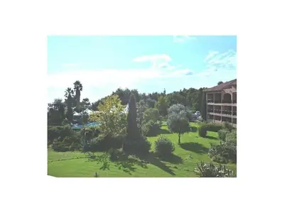 a view of a park in front of a building at Marines de Moriani in Moriani Plage