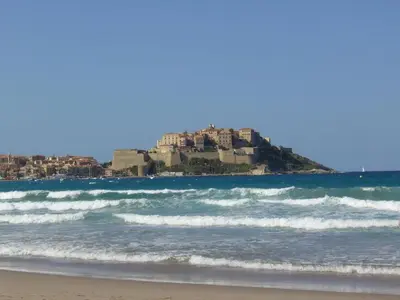 a view of the beach with a resort on a hill at Cabin in Montegrosso with Wi-Fi in Montegrosso