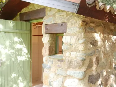 a bathroom with a sink and a mirror at Cabin in Montegrosso with Wi-Fi in Montegrosso