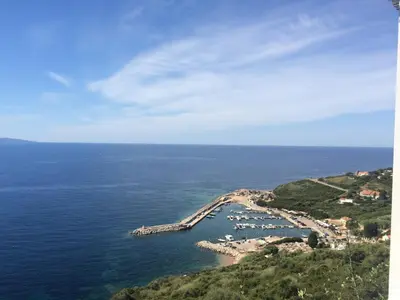 an aerial view of a harbor in the ocean at Bel Mare in Cargèse