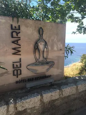 a sign for a hotel bar restaurant with at Bel Mare in Cargèse