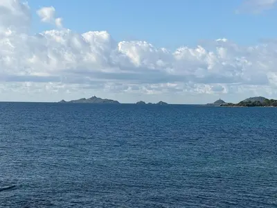 a large body of water with islands in the distance at Villa Rétine in Ajaccio