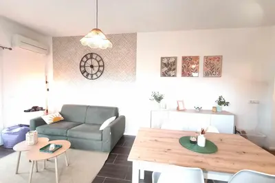 a living room with a couch and a table at Bright apartment in Albitreccia near beach in Albitreccia