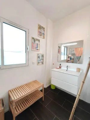 a bathroom with a sink and a mirror at Bright apartment in Albitreccia near beach in Albitreccia