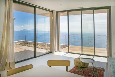 a room with a view of the ocean at Villa petra mare in Cargèse