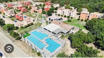 an aerial view of a house with a swimming pool at Résidence Luna, Saint-Cyprien in Porto-Vecchio