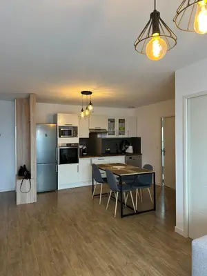 a kitchen and dining room with a table and chairs at Appartement T2 calme et paisible Vescovato in Venzolasca