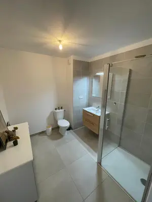 a bathroom with a shower and a toilet and a sink at charmant appartement a ajaccio in Ajaccio