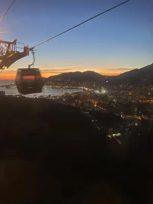 a gondola ride up a hill at sunset at charmant appartement a ajaccio in Ajaccio