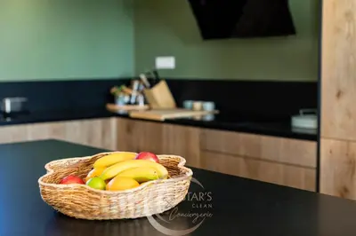 a basket of fruit on a table in a kitchen at Villa Neuve Corse sud avec vue mer et piscine chauffée in Pianottoli-Caldarello