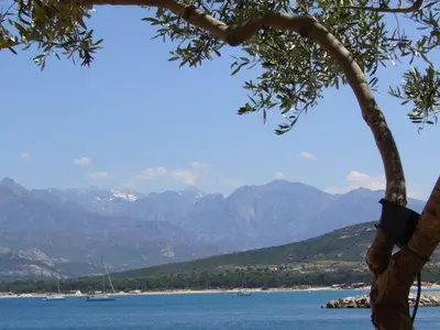 a view of a body of water with mountains at Holiday apartment with 1 bedroom in Montegrosso