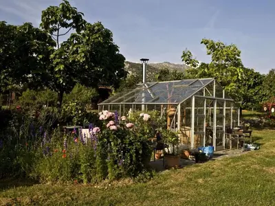 an old stone building with an arch in a field at Holiday apartment with 1 bedroom in Montegrosso