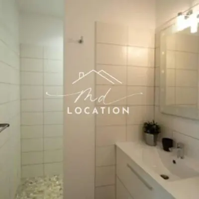 a bathroom with a toilet and a sink and a mirror at Villa route de Palombaggia in Porto-Vecchio