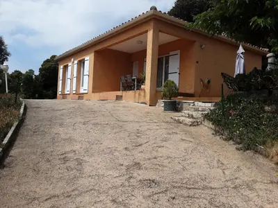 a house with a driveway in front of it at La Palombière - La Bruyère in Casalabriva