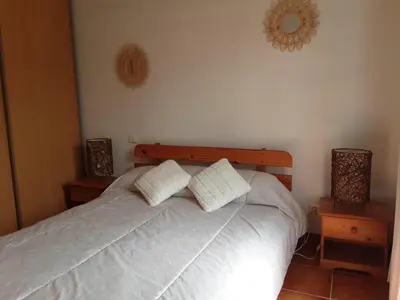 a bedroom with a bed with two pillows on it at La Palombière - La Bruyère in Casalabriva