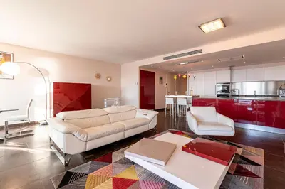 a living room with a couch and a table at Strada Agosta - Terrasse vue mer in Albitreccia