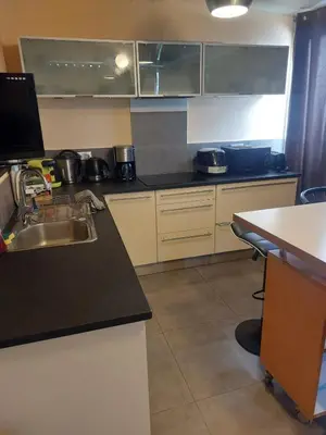 a kitchen with a sink and a counter top at AJACCIO GRAND STUDIO LOFT VUE MER ET MONTAGNE 5 p in Ajaccio
