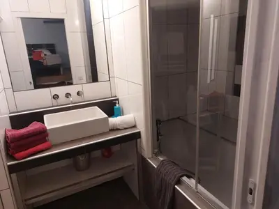 a bathroom with a sink and a shower at AJACCIO GRAND STUDIO LOFT VUE MER ET MONTAGNE 5 p in Ajaccio