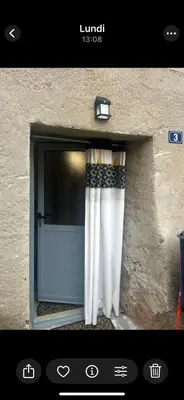 a picture of a window with a curtain at Zilia in Zilia