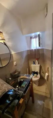 a small bathroom with a sink and a toilet at Zilia in Zilia