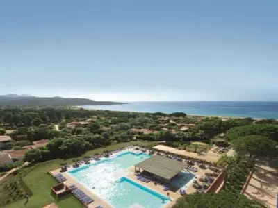 an aerial view of a swimming pool with the ocean at Beautiful holiday home in Solenzara in Kamiesch