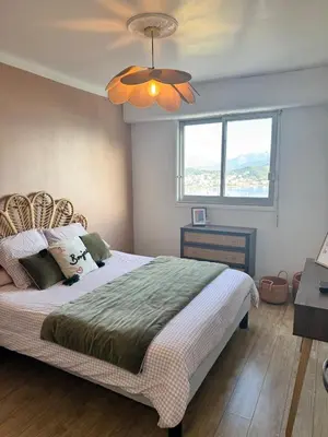 a bedroom with a bed and a ceiling fan at Nouveau ! Sublime T2 Ajaccio in Ajaccio