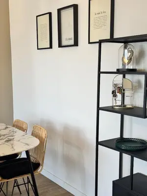 a dining room with a table and a shelf at Nouveau ! Sublime T2 Ajaccio in Ajaccio