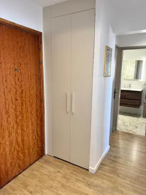 a room with a closet and a wooden door at Nouveau ! Sublime T2 Ajaccio in Ajaccio