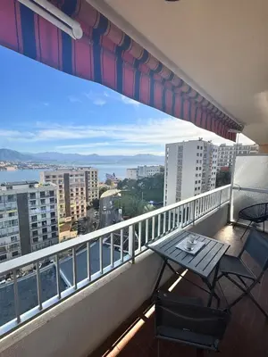 a balcony with a table and chairs on a balcony at Nouveau ! Sublime T2 Ajaccio in Ajaccio