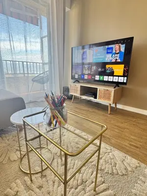 a living room with a large flat screen tv at Nouveau ! Sublime T2 Ajaccio in Ajaccio