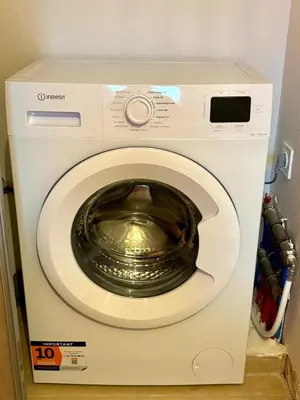 a washing machine with a bowl inside of it at Appartement 2 chambres - Rez-de-jardin - Avec piscine in Oletta