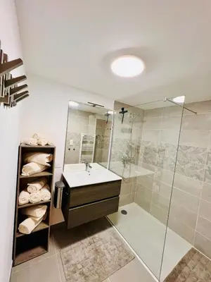 a bathroom with a sink and a shower at Alivu Immurtale - T3 design standing & confort, terrasse XXL in Propriano
