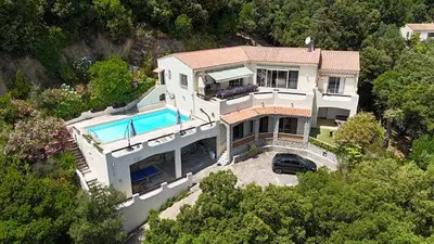 an aerial view of a house with a swimming pool at Villa la Chiosella in Valle-di-Mezzana